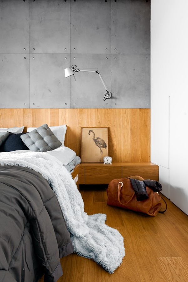 Beton dekoracyjny i drewno w sypialni styl nowoczesny