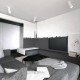 Minimalistyczny salon otwarty na jadalnię Maka Studio
