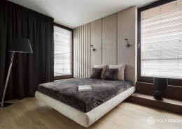 Piękna sypialnia w minimalistycznym wydaniu z tapicerowaną ścianą
