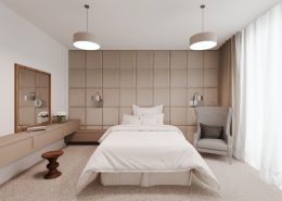 Beżowa sypialnia z tapicerowaną ścianą Nasciturus Design