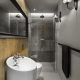Mała łazienka wykończona drewnem i betonem Hola Design