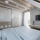 Projekt sypialni na poddaszu wykończonej drewnem Concept