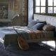 Nowoczesne łóżko z tapicerowanym wezgłowiem - Poltrona Frau